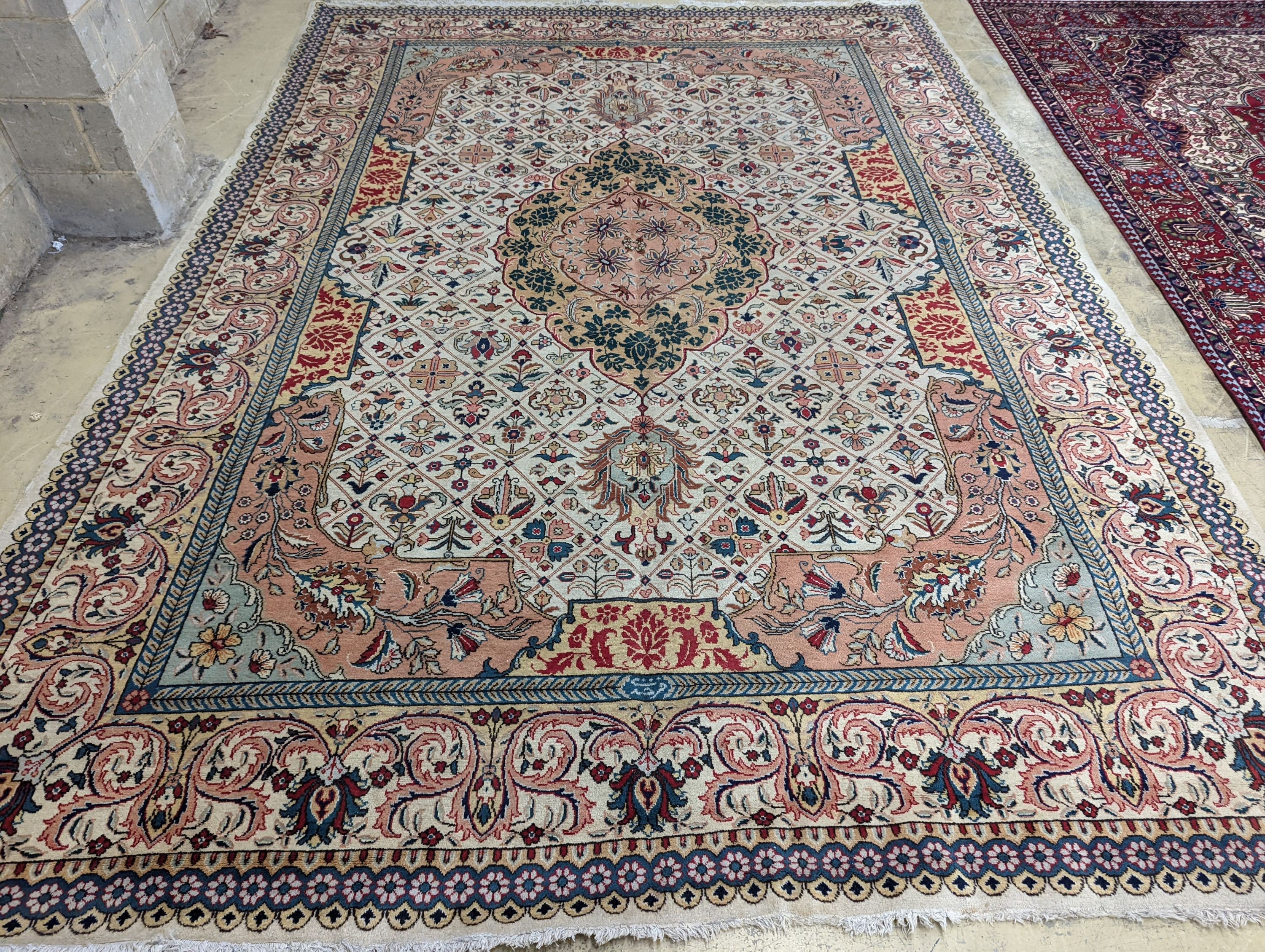 A Tabriz ivory ground carpet, 425 x 306cm